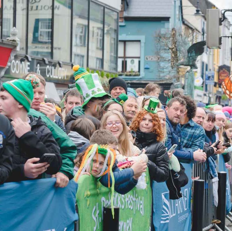 crowds lined up at roadside ready to watch the St. Patrick's Day parade